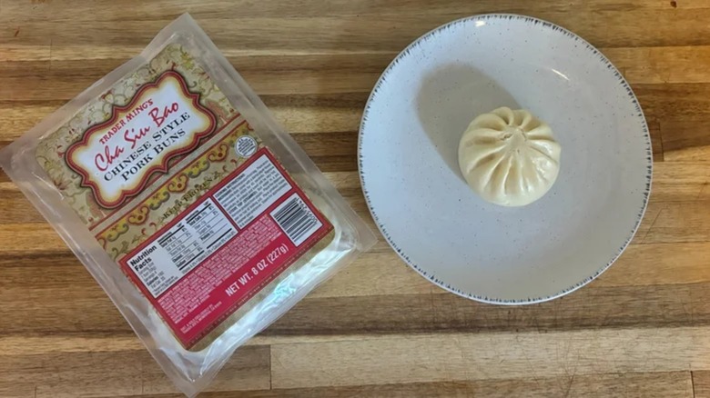 Trader Joe's Cha Siu Bao package next to bao on white plate