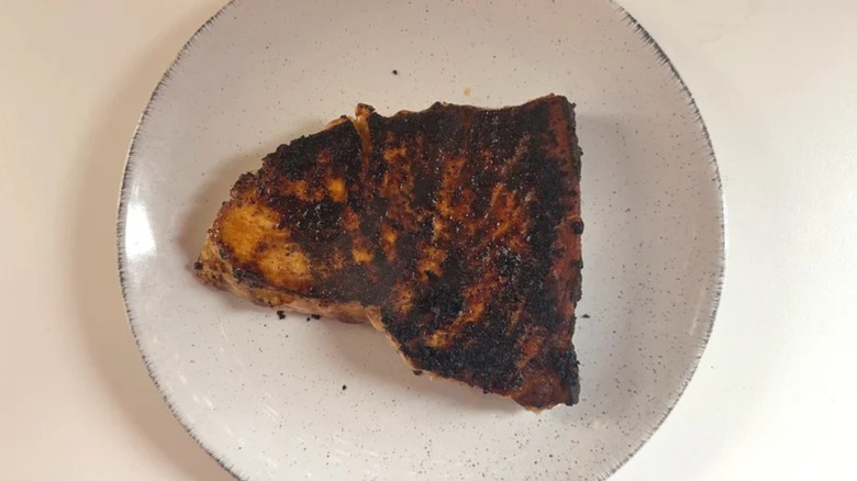 Cooked Trader Joe's swordfish steak on white plate