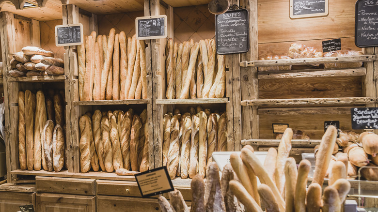 Baguettes displayed on wooden shelves