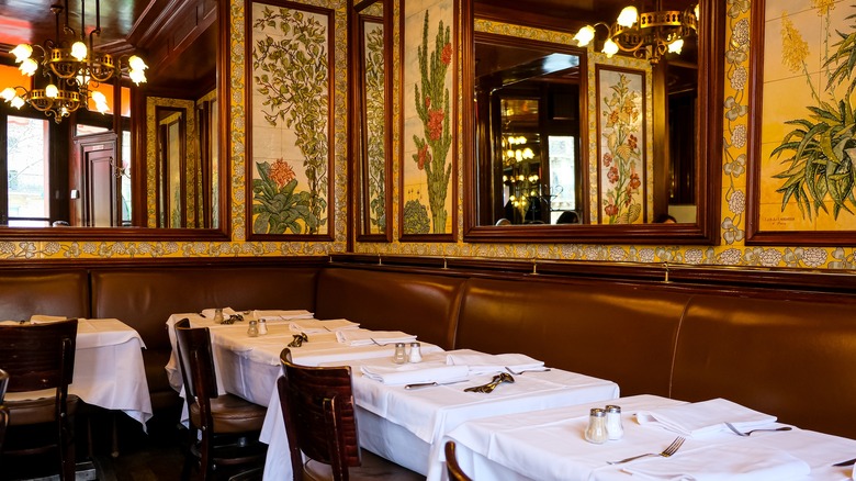 Brasserie dining room with white tablecloth-covered tables