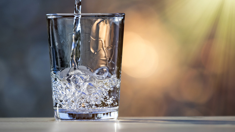 Water pouring into a glass