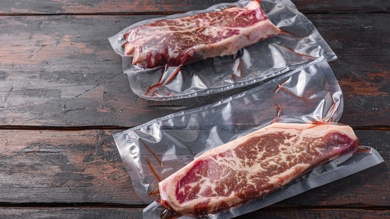 Vacuum packed steak cuts wrapped in plastic