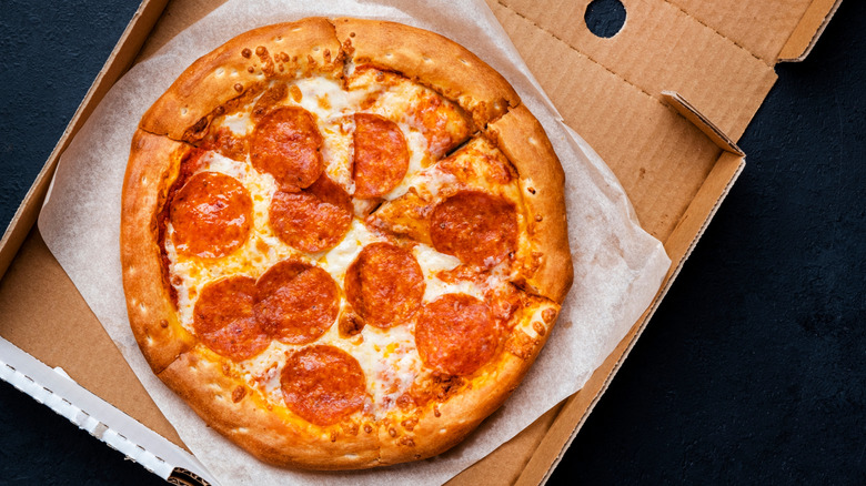 Pepperoni pizza in carboard box