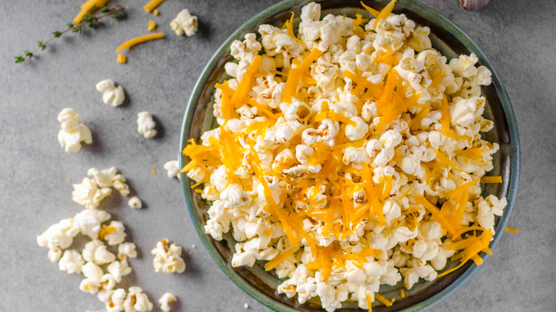 Homemade popcorn with cheese in bowl