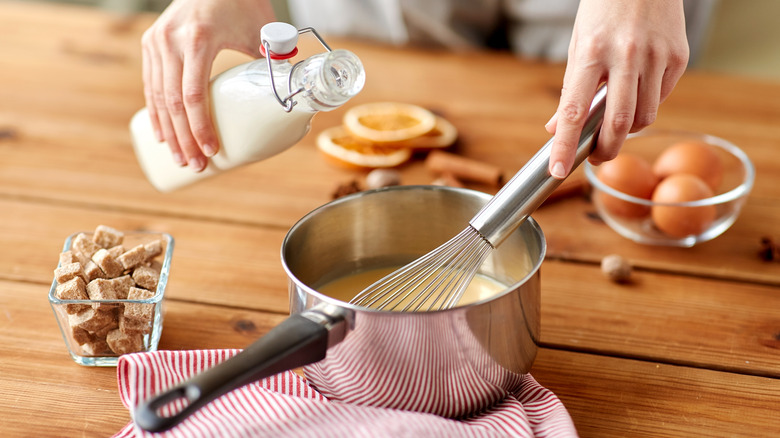 Eggnog being prepared with ingredients