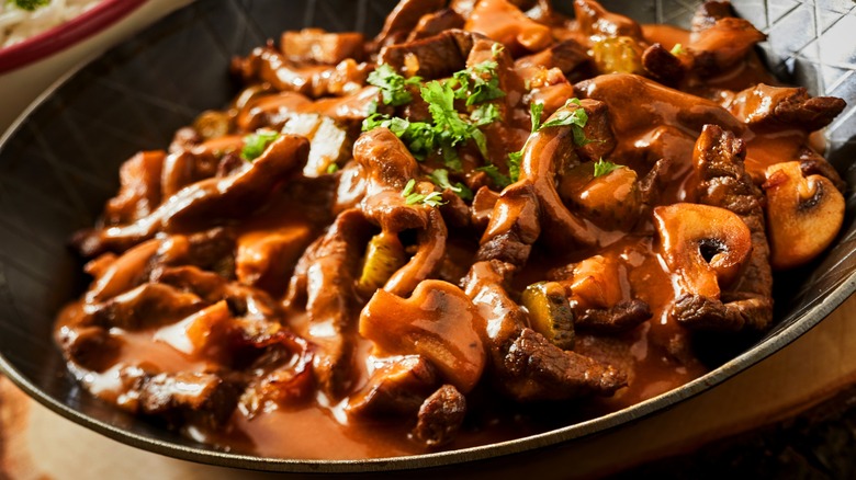 braised mushrooms in skillet