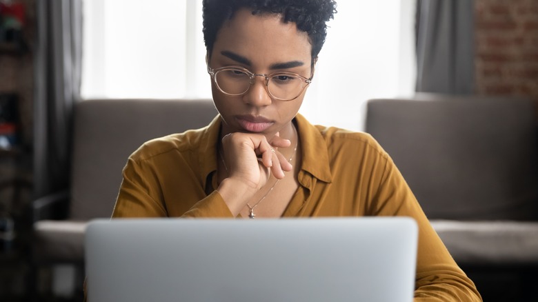 Woman researching on computer