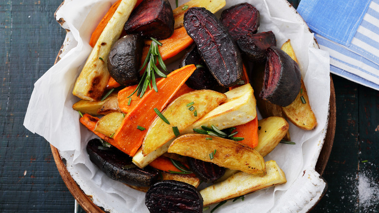 bowlful of roasted parsnips beetroot and sweet potato