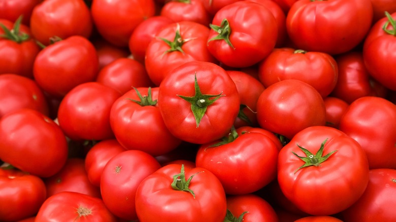 bright red tomatoes with green stems