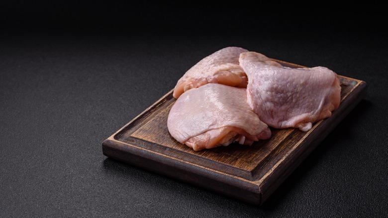 Fresh raw chicken thighs