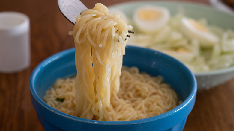 Bowl of ramen noodles with fork