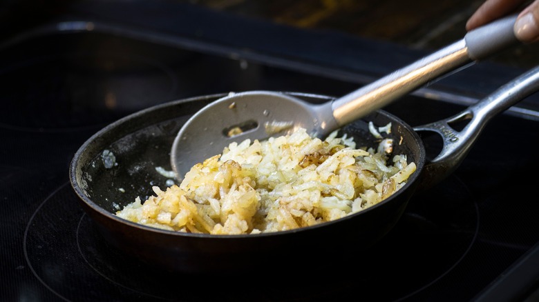 Shredded hash browns in skillet