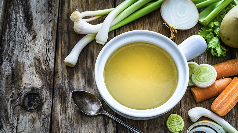 Bowl of broth, celery, vegetables