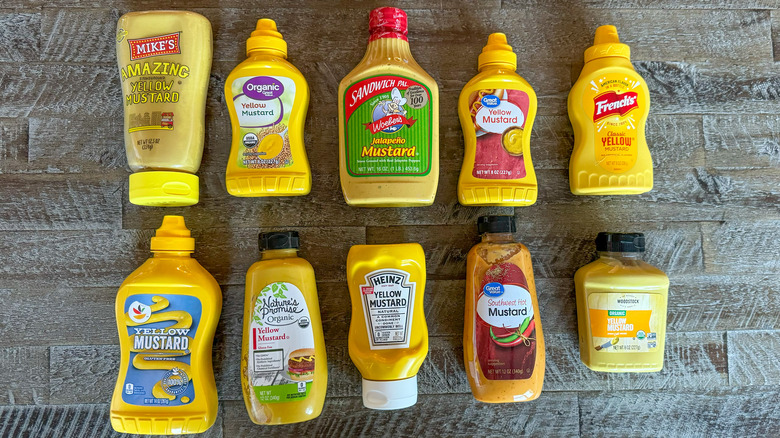 Mustard brands on wooden table