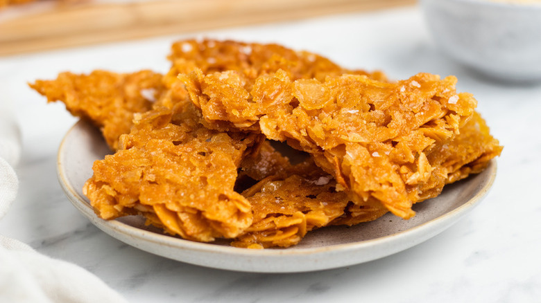 Almond brittle on plate