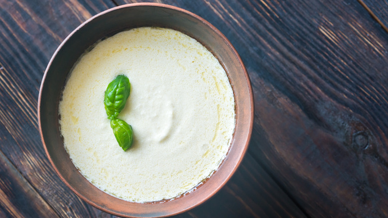 White sauce in brown bowl 