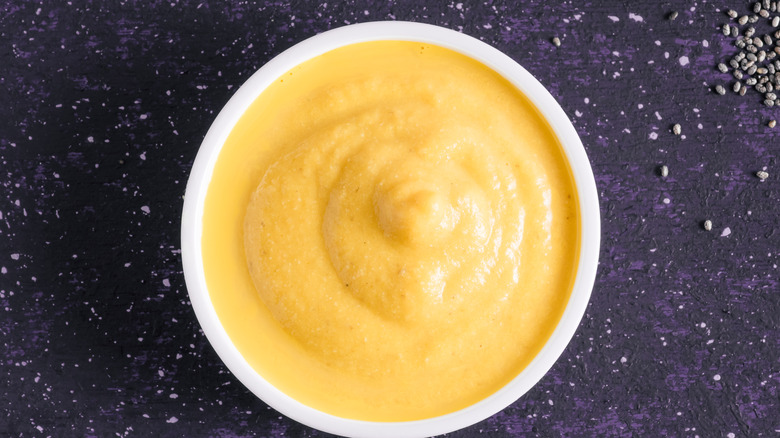 Yellow sauce in white dish 