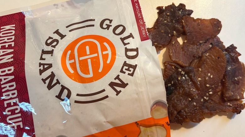 Golden Island Korean Barbecue Pork Jerky spilling out of bag onto white table