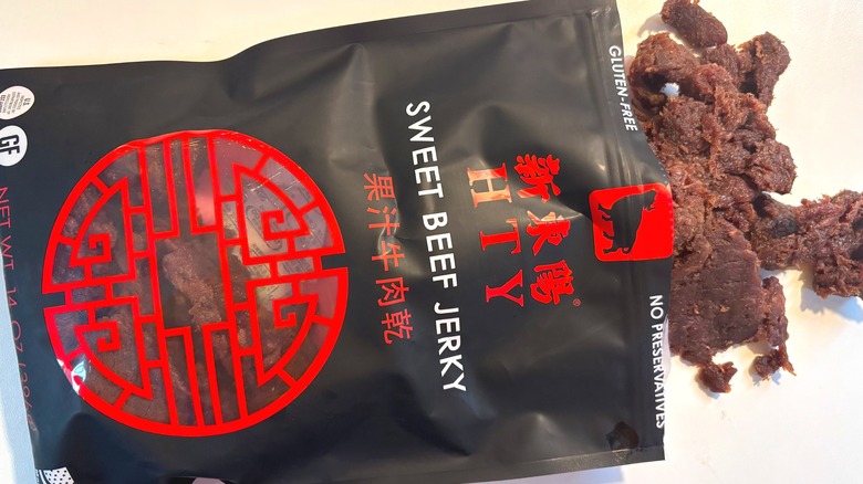 HTY Sweet Beef Jerky spilling out of bag onto white table