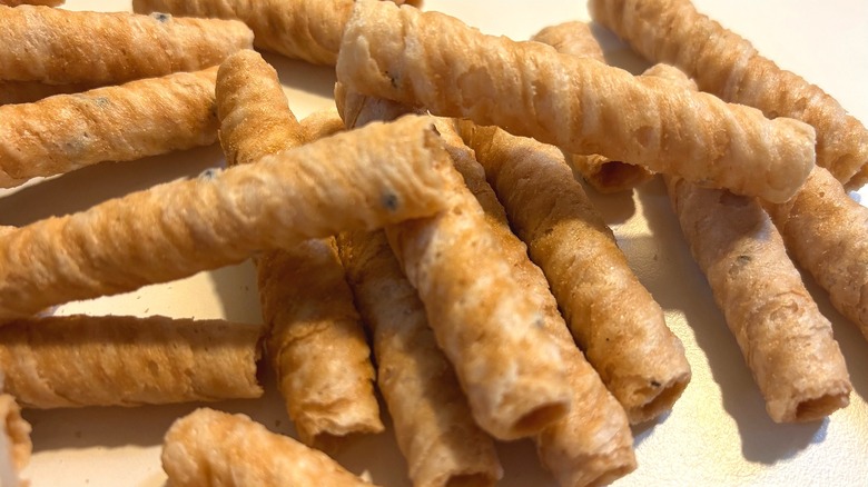 Pile of Organic Light & Crispy Coconut Rolls on table