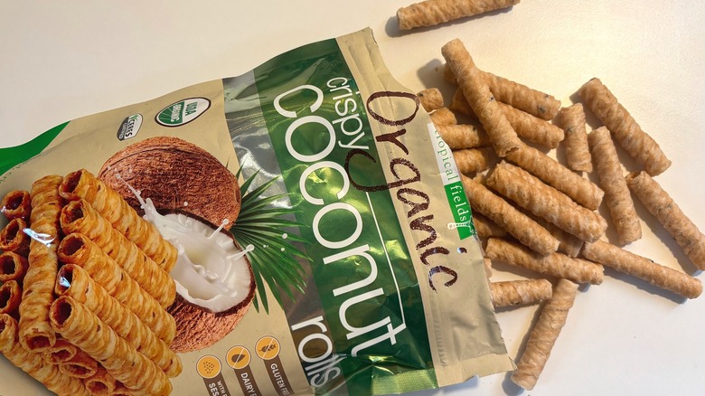 Crispy Coconut Rolls spilling out of bag onto white table