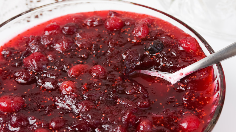 cranberry sauce in bowl with spoon