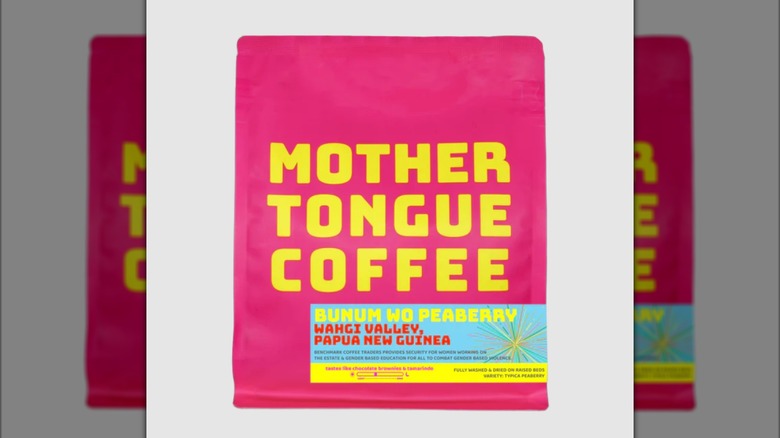 Pink bag of Bunum Wo Peaberry from Mother Tongue Coffee on solid white background