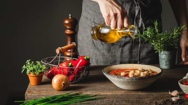 oil being added to soup