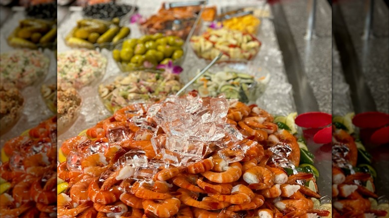 Shrimp on the buffet at The Nordic with other blurred foods