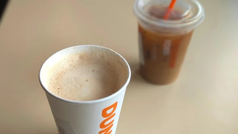 White Dunkin' Donuts branded hot coffee cup.