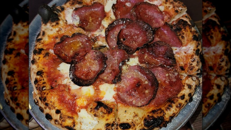 pizza topped with meat