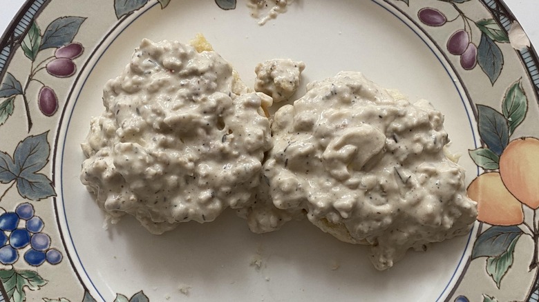 Biscuits and gravy on patterned plate