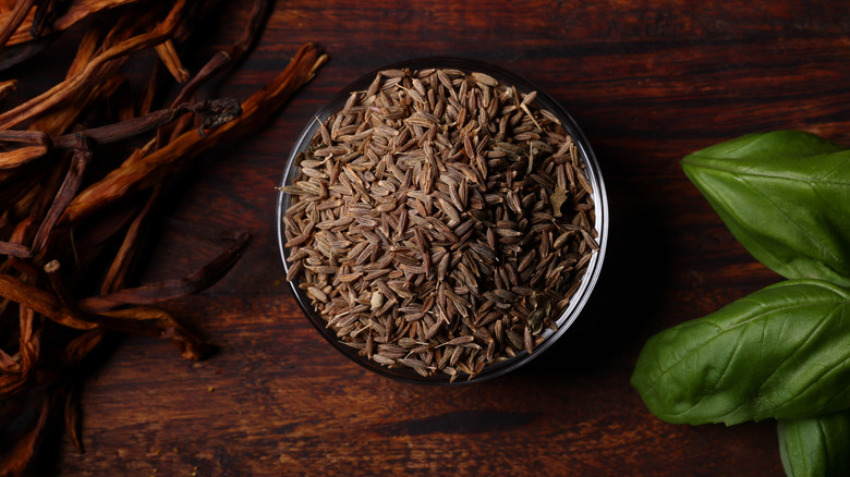 Bowl brimming with cumin seeds