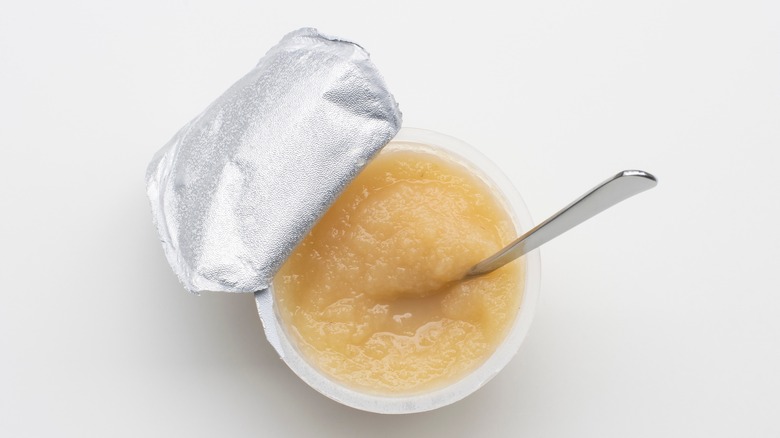 Applesauce cup on white background