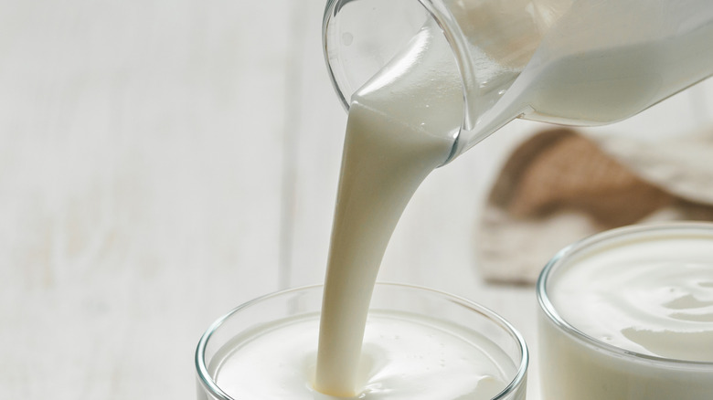 Pouring buttermilk into glass