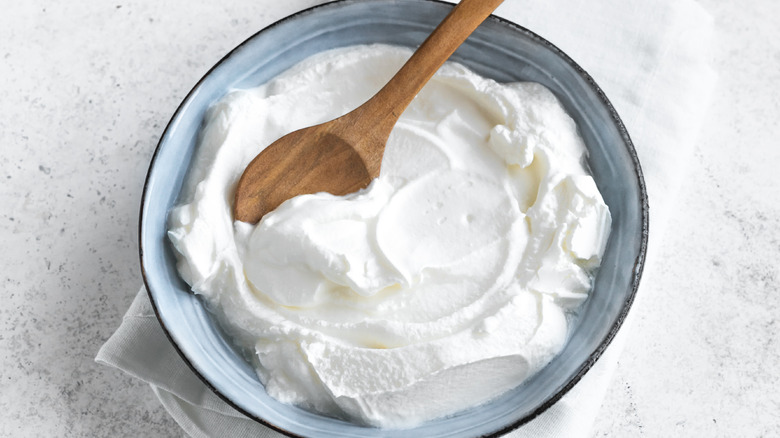 Yogurt in bowl on table