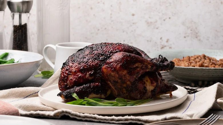 blackberry-glazed sage roast chicken on plate