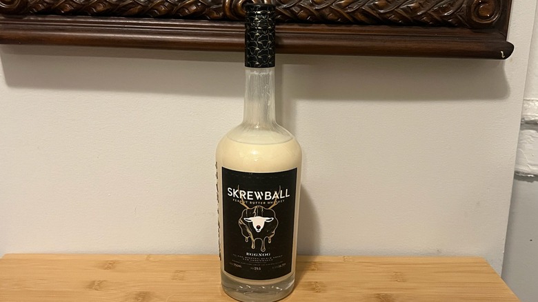 Skrewball Peanut Butter Whiskey Eggnog bottle on table