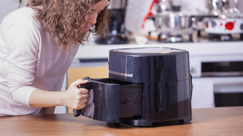 Woman using an air dryer