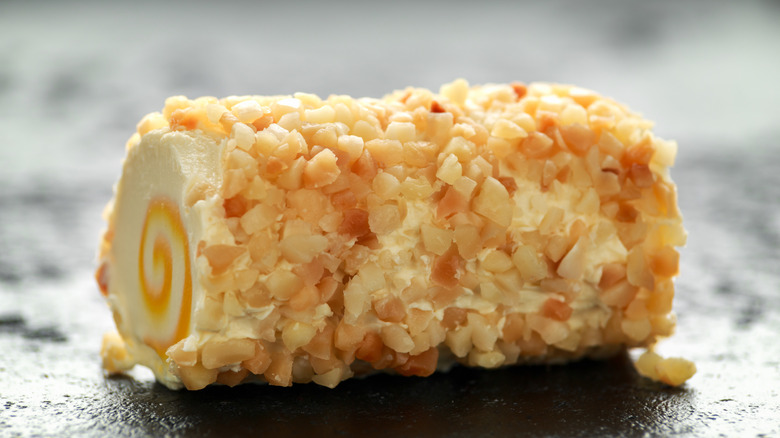 Pineapple flavored cream cheese coated with chopped nuts