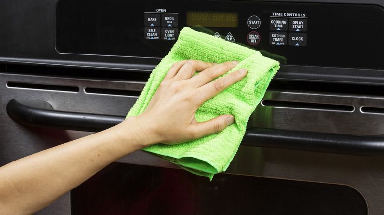 Wiping down outside of oven