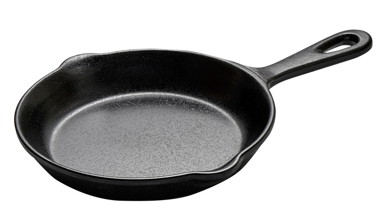 Cast iron skillet on white background