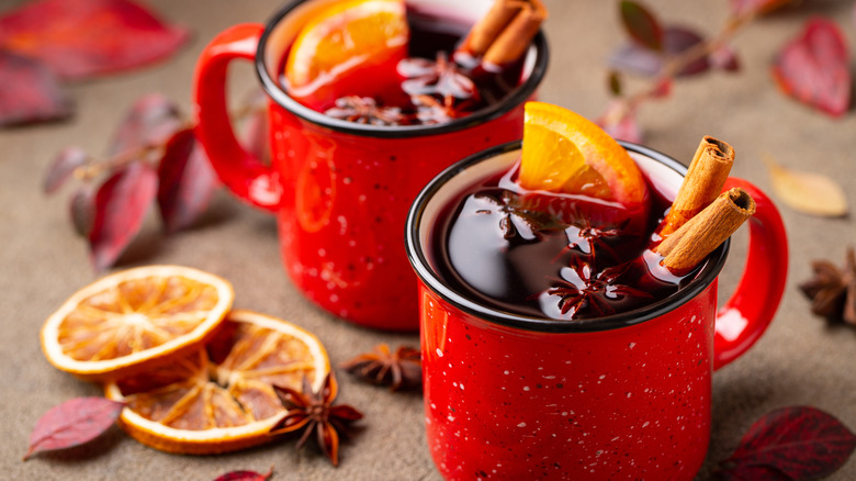 Mulled wine cups with oranges