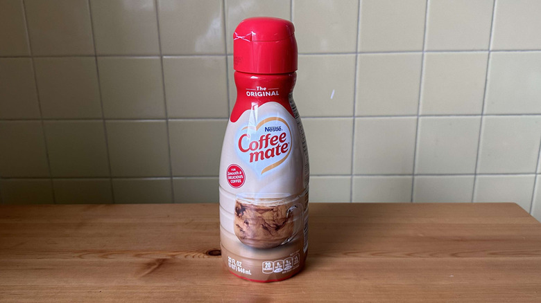 Original Coffee Mate creamer on wooden table