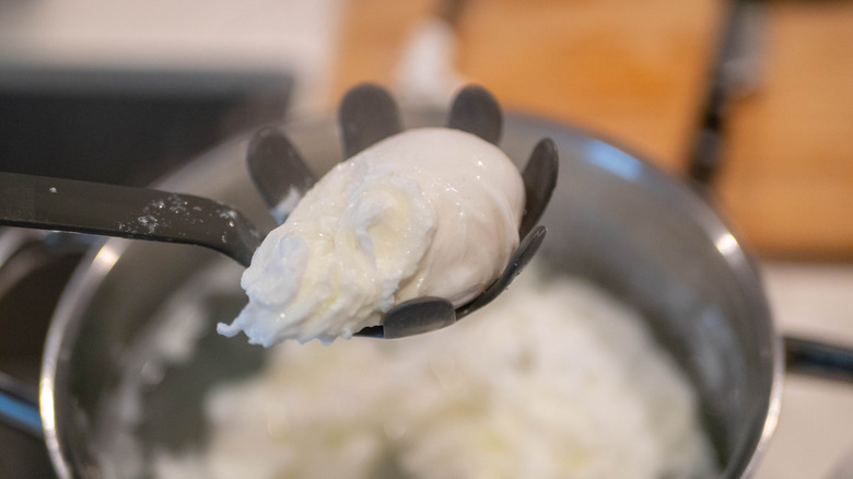 Poached egg coming out of water