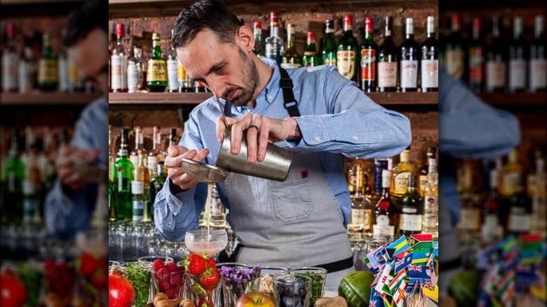 Bartender mixing Commonwealth cocktail