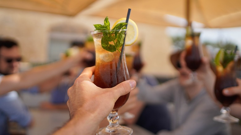 Person holding Long Island drink