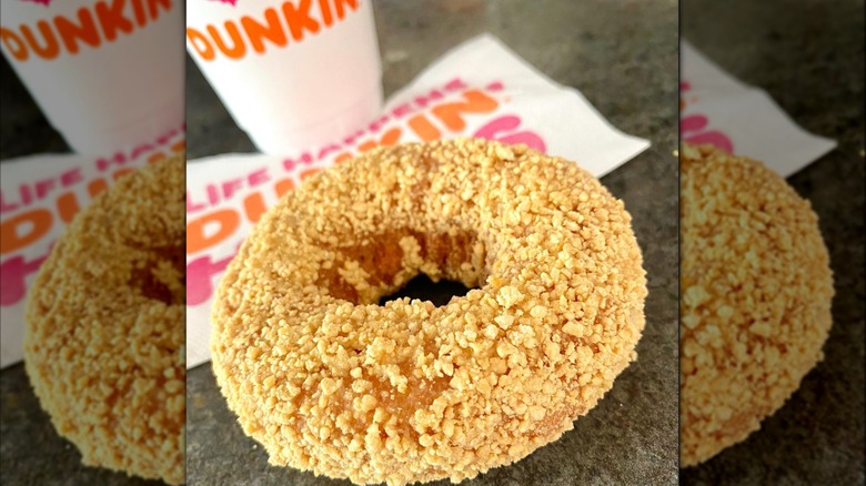 Butternut donut on table with Dunkin' cup