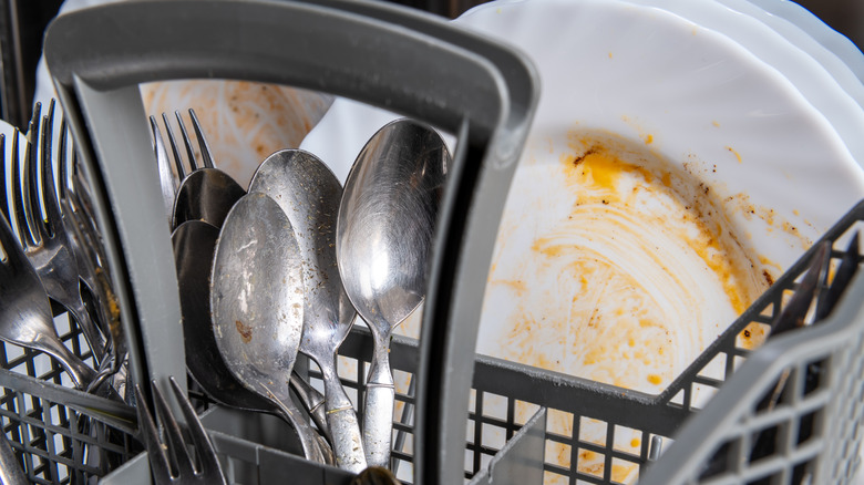 Dirty utensils in dishwasher