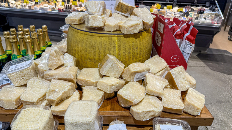 Display of Parmigiano Reggiano cheese at Whole Foods